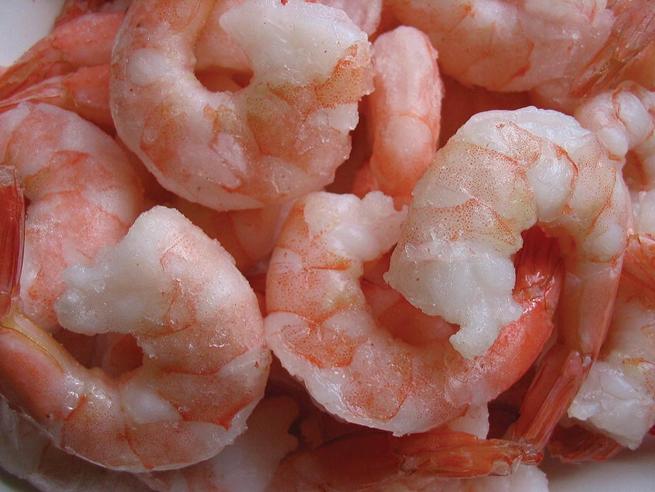 A pile of peeled and cooked shrimps.