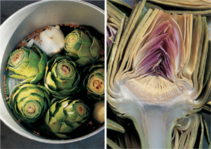 Artichokes in a pot of water and one cut in half