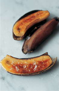 Caramelizing the bananas with a blowtorch