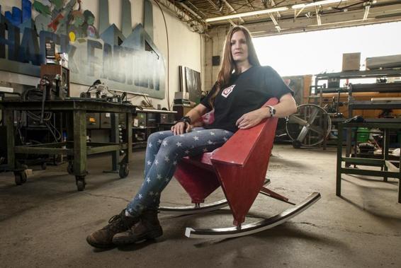 Susan Solarz reclines in her Origami Chair. Photo copyright E. Katie Holm, http://katieholm.com.