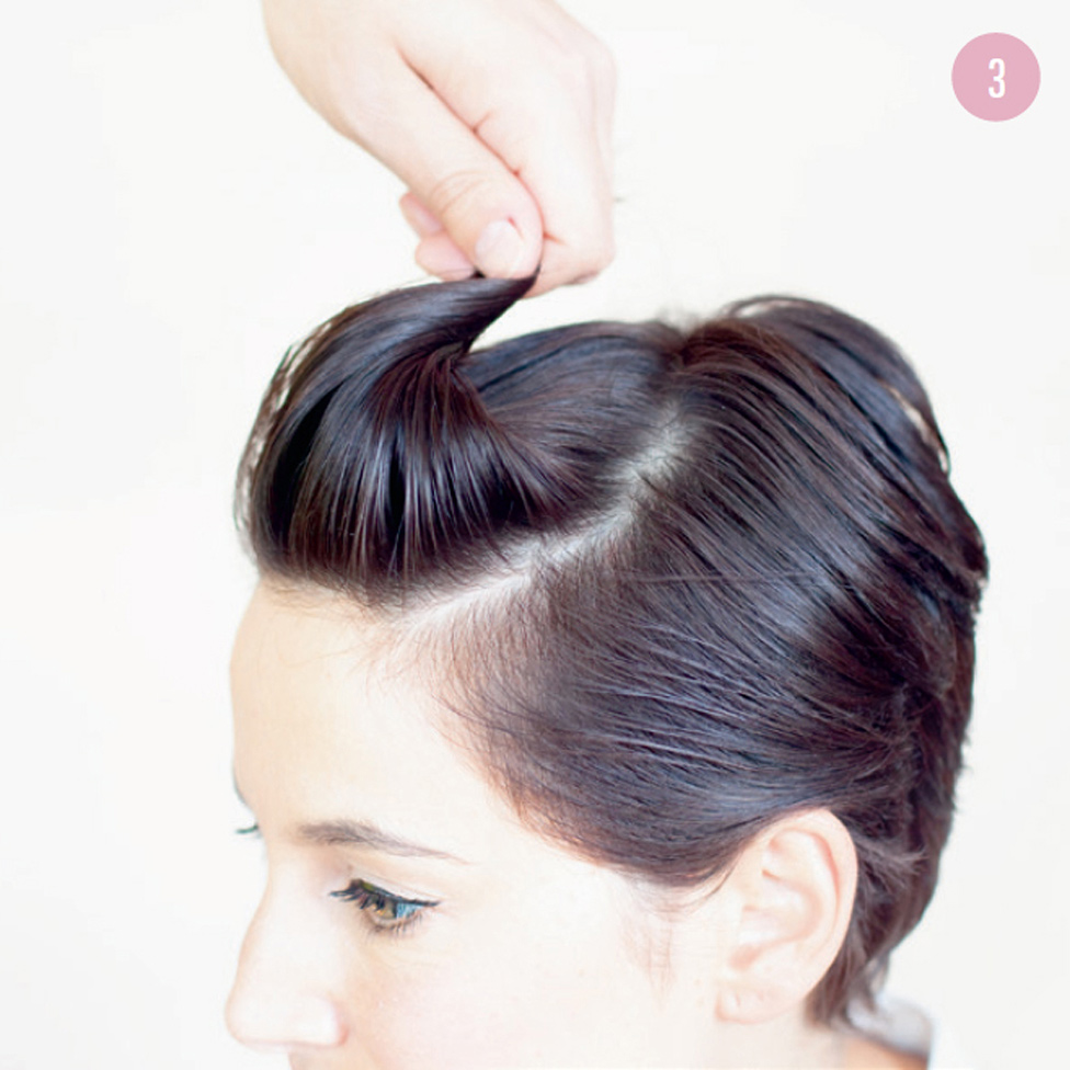 3 Bring the hair up into a slight pouf by twisting the ends