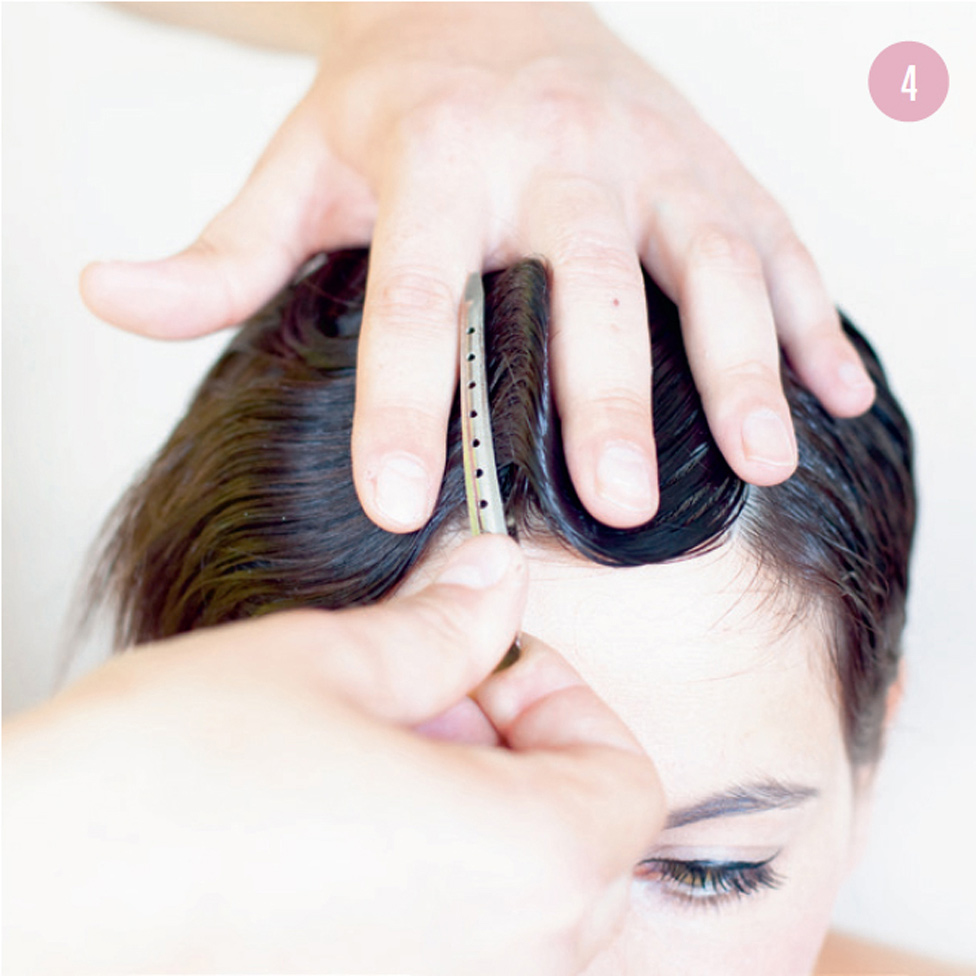 4 Set the waves in place with an alligator clip, then repeat the process several times to achieve the desired effect