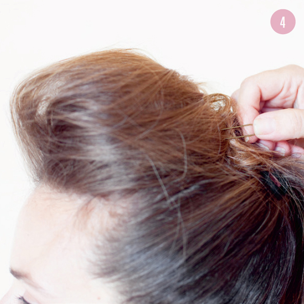 4 Secure the twirled ends with fringe pins at the same level as the ponytail elastic