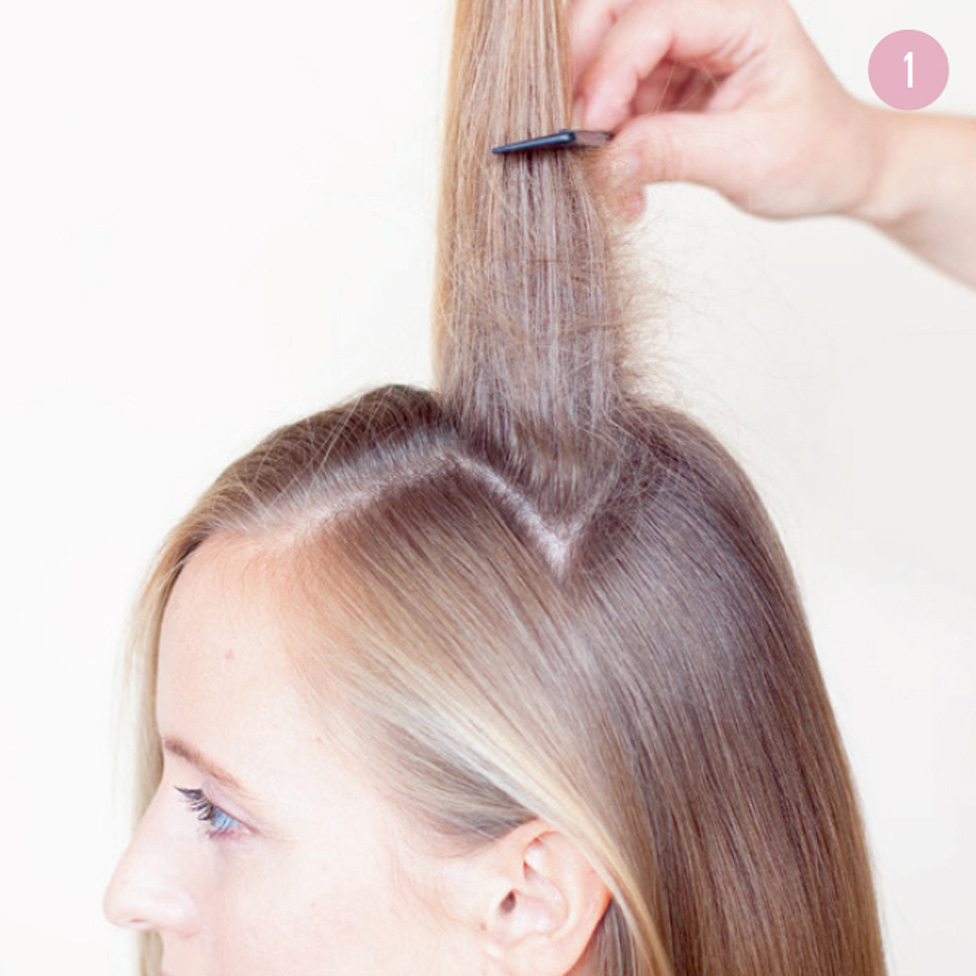 1 Part your hair on the side at the front of your head. From the back section of hair, pull out smaller sections and use a comb to tease close to the roots