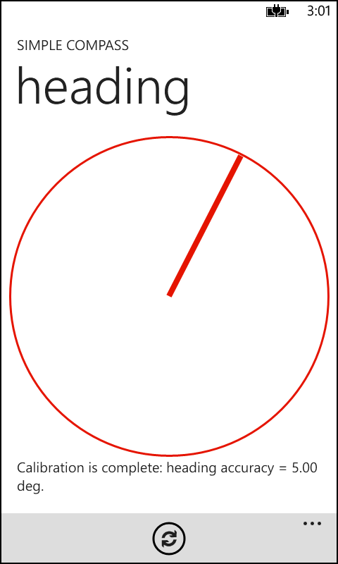 A screenshot of the SimpleCompass solution in action. The screen is mostly taken up with a primitive analog compass display. This display comprises a thin red circle with a red compass needle. The compass needle is pointing at approximately 15 degrees (or 2 o’clock). Below that is a simple text string that reports the current heading accuracy as 5.00 degrees.