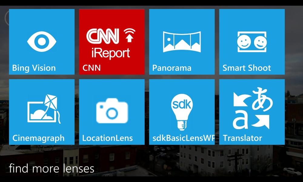 A screenshot of the lens picker. Lenses are shown as a grid of tiles overlaying the camera viewfinder.