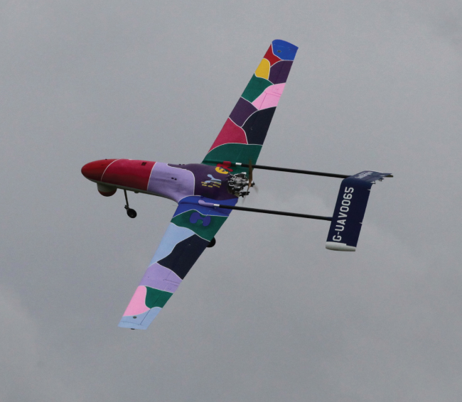 Illustration of Decode-2 in flight with nose camera fitted.