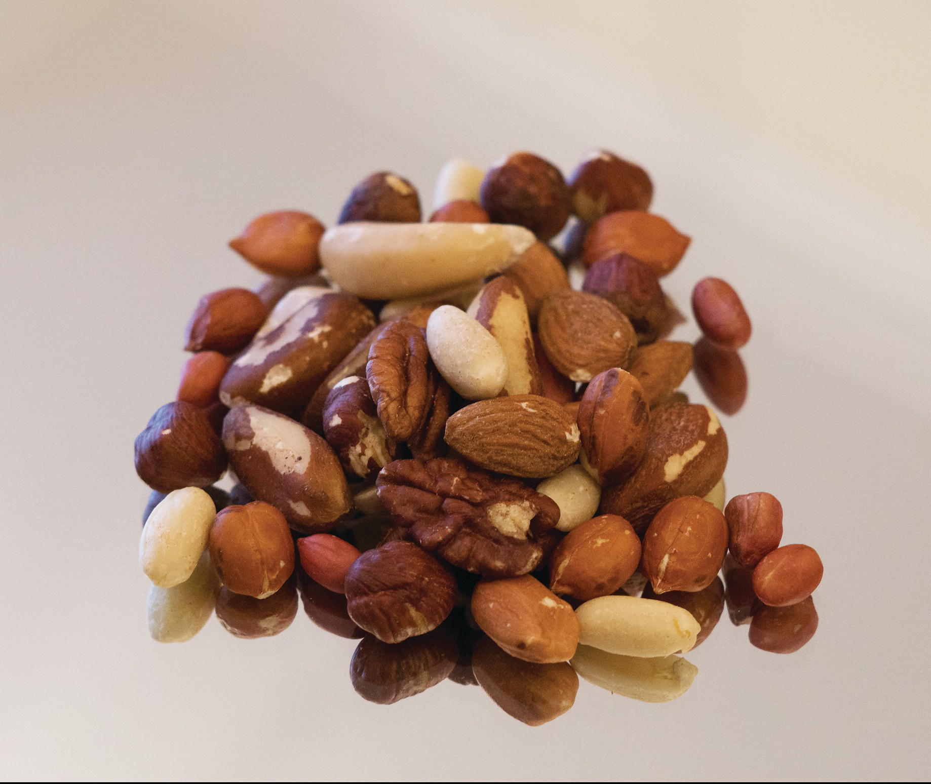 Photo displaying a heap of various nuts.