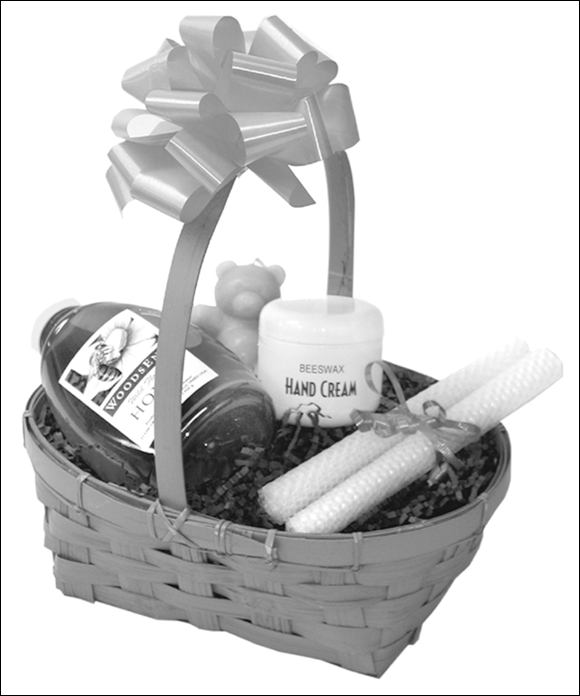 Photograph of a basket full of honey products to be given off as a gift to someone.