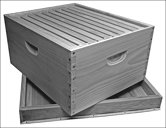 Picture depicting how to use the outer cover of a hive (placed on the ground bottom-side-up) as a surface on which to place the hive bodies while disassembling the hive for inspection.