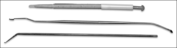 Picture of three different kinds of grafting tools to lift the delicate and fragile larva out of its original worker cell and place it gently in the cup on the cell bar frame.