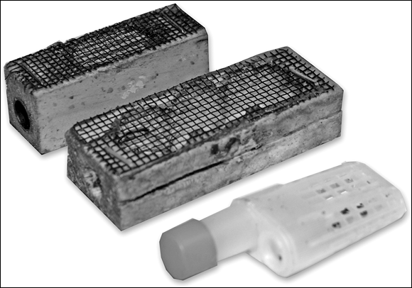 Picture displaying 3 different kinds of cages designed to confine the queen and provide, via screen or perforations, a way for the bees outside of the cage to feed the queen inside.