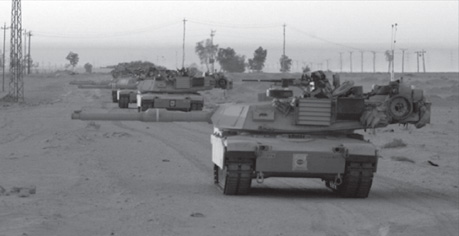 1st Brigade moves through the Karbala Gap. All guns face Karbala, where the 2-69 AR Battalion is fighting hard to secure the city.