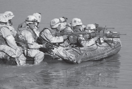 1st Brigade Engineers cross the Euphrates under fire to seize the far end of the bridge at Objective Peach. The boat engine quit, forcing the engineers to paddle while being shot at.