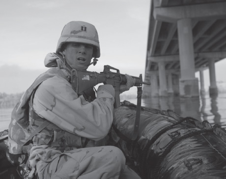 Engineer company commander Captain Hibner prepares to cross the Euphrates while under direct Iraqi fire.