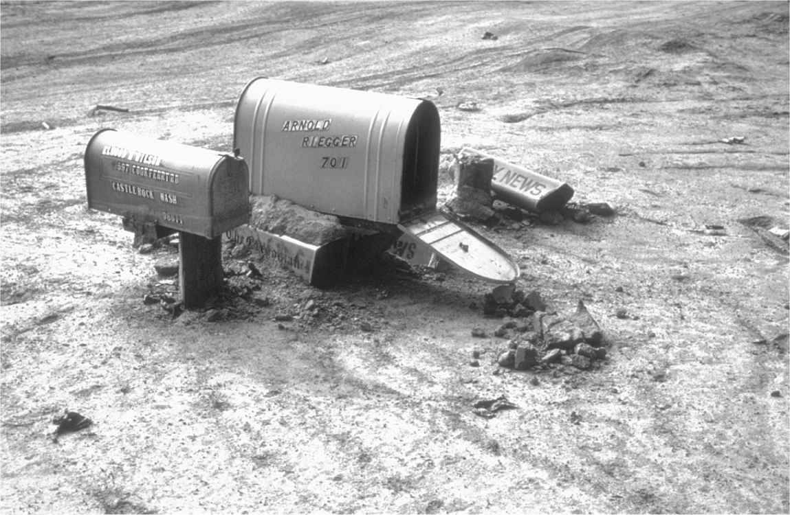 Mailboxes nearly buried in hot ash from the eruption of Mount Saint Helens. (Photo courtesy U.S. Geological Survey)