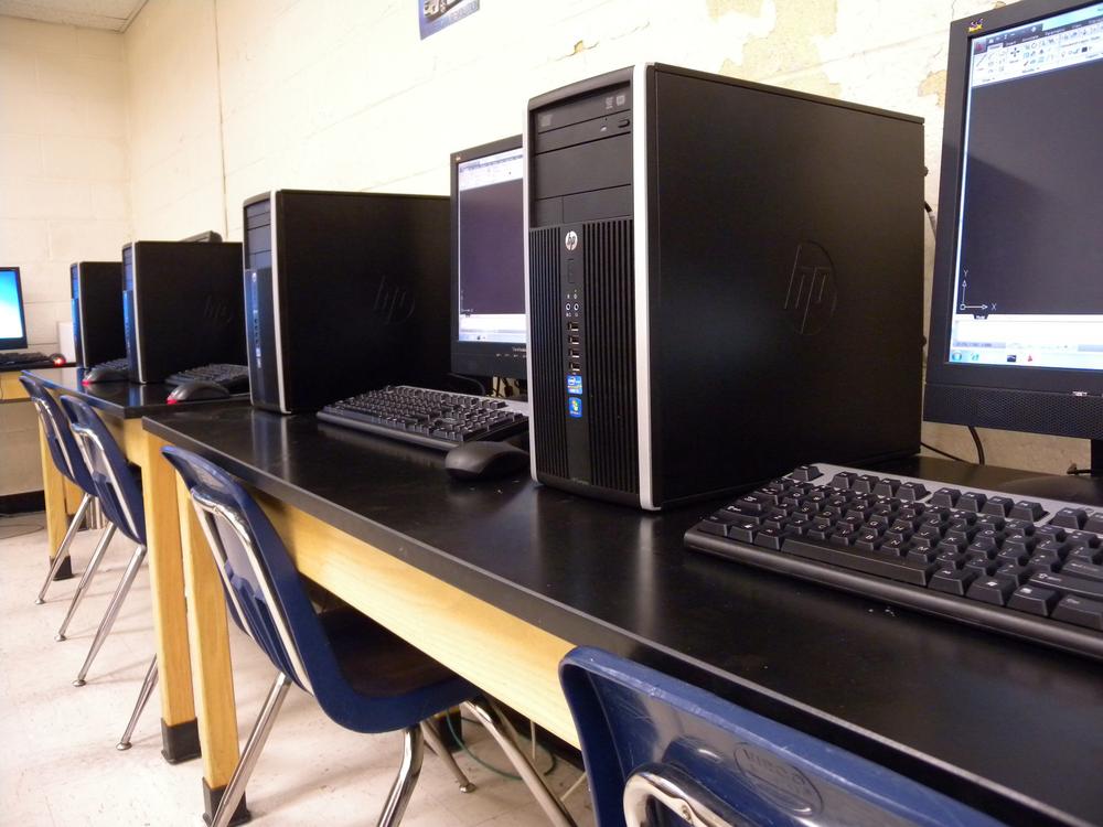 The computer station not only contains a computer, but has a small amount of open work space for writing and working on projects.