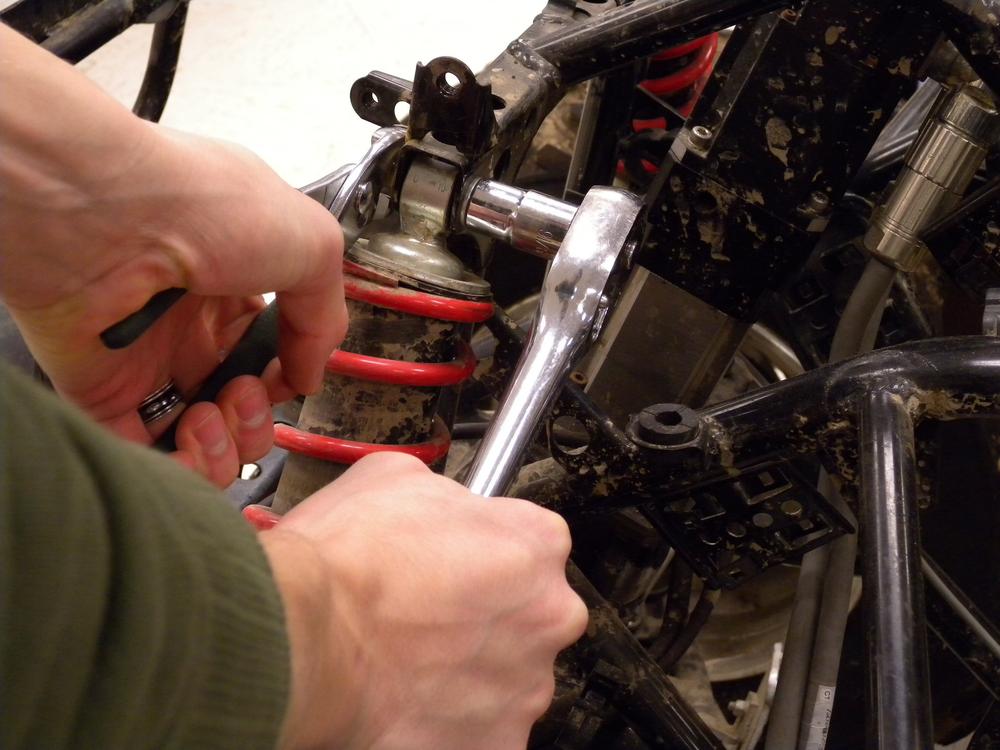 If a second wrench is not available to remove a fastener, use a pair of pliers to hold the fastener stationary while twisting only the wrench.