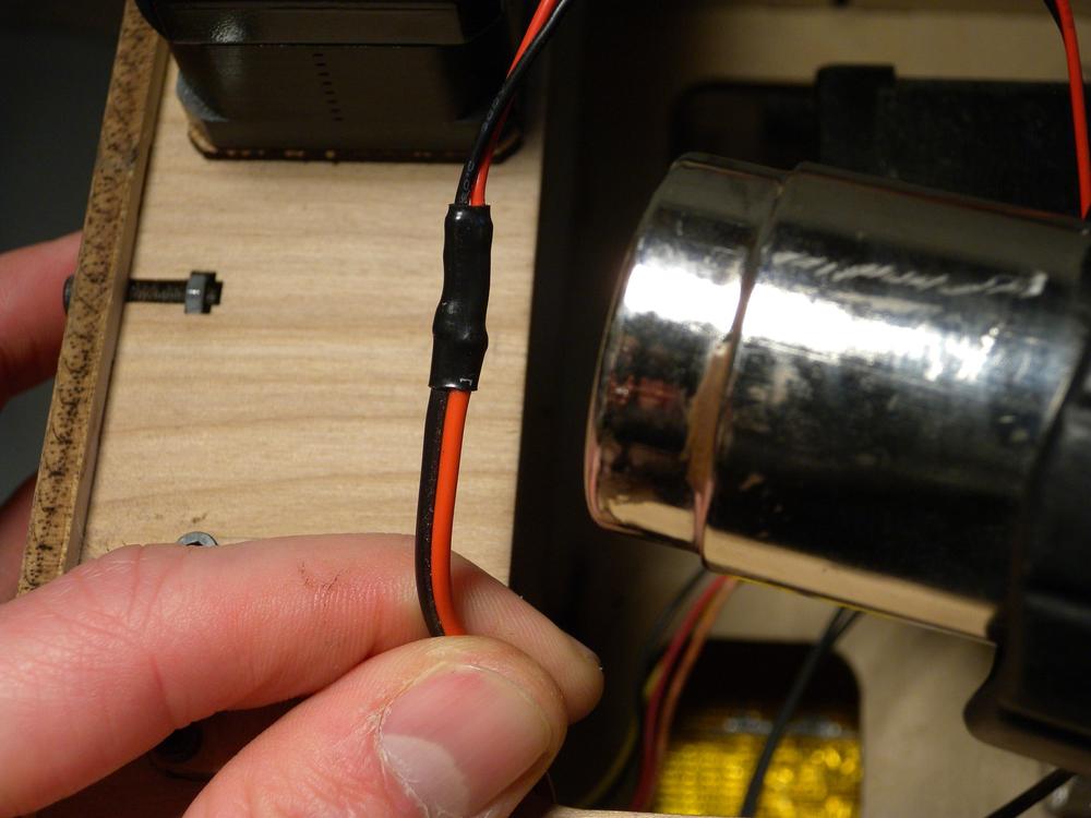 Heat heat-shrink tubing with a heat gun to evenly shrink it.