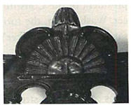 A close-up view of the “rising sun” crest that inspired Benjamin Franklin to make his famous remark that immortalized the chair.