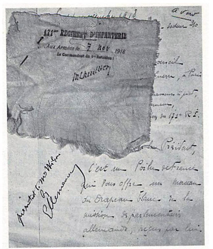 A patch of the World War I truce flag pinned to the letter to Georges Clemenceau that accompanied it.