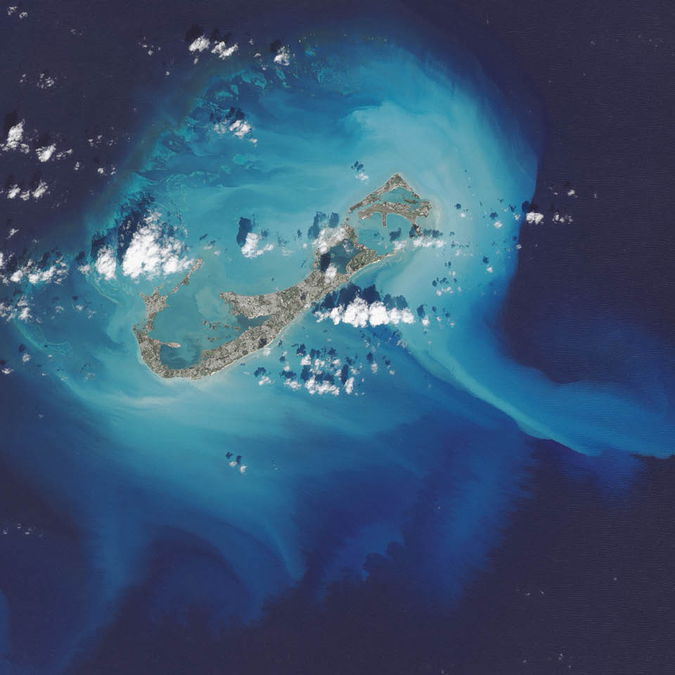 In October 2014, the eye of Hurricane Gonzalo passed right over Bermuda. In the process, the potent storm stirred up the sediments in the shallow bays and lagoons around the island, spreading a huge mass of sediment across the North Atlantic Ocean. This Landsat 8 image shows the area after Gonzalo passed through. The suspended sediments were likely a combination of beach sand and carbonate sediments from around the shallows and reefs. 