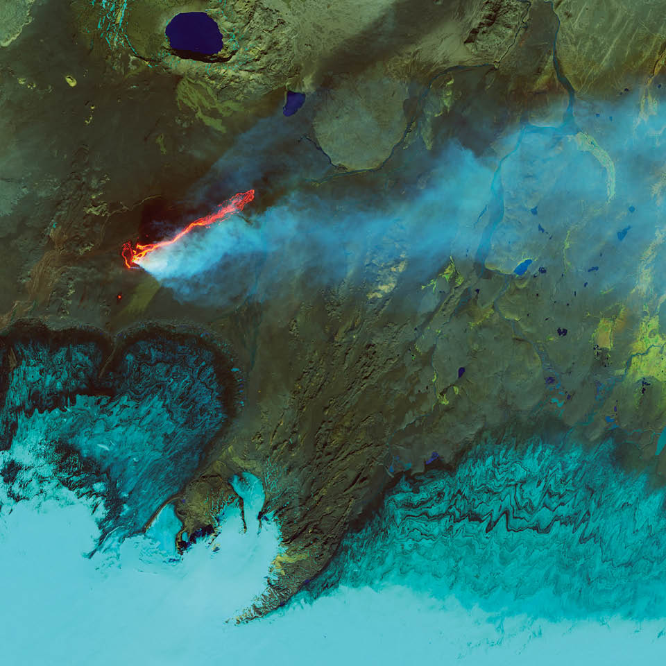 As an island in the moist, turbulent North Atlantic, Iceland is often shrouded in clouds and difficult to observe from space. In 2014, the island started making some of its own cloud cover, as the Earth split open between the Bárðarbunga and Askja volcanoes and spewed lava and hot gas.  Landsat 8 captured this view of the eruption in September 2014. The false-color image combines shortwave infrared, near-infrared, and green light. Ice and the plume of steam and sulfur dioxide appear cyan and bright blue, while liquid water is navy blue. Bare or rocky ground around the Holuhraun lava field appears in shades of green or brown, and fresh lava is bright orange. Offshore clouds appear in bright cyan.