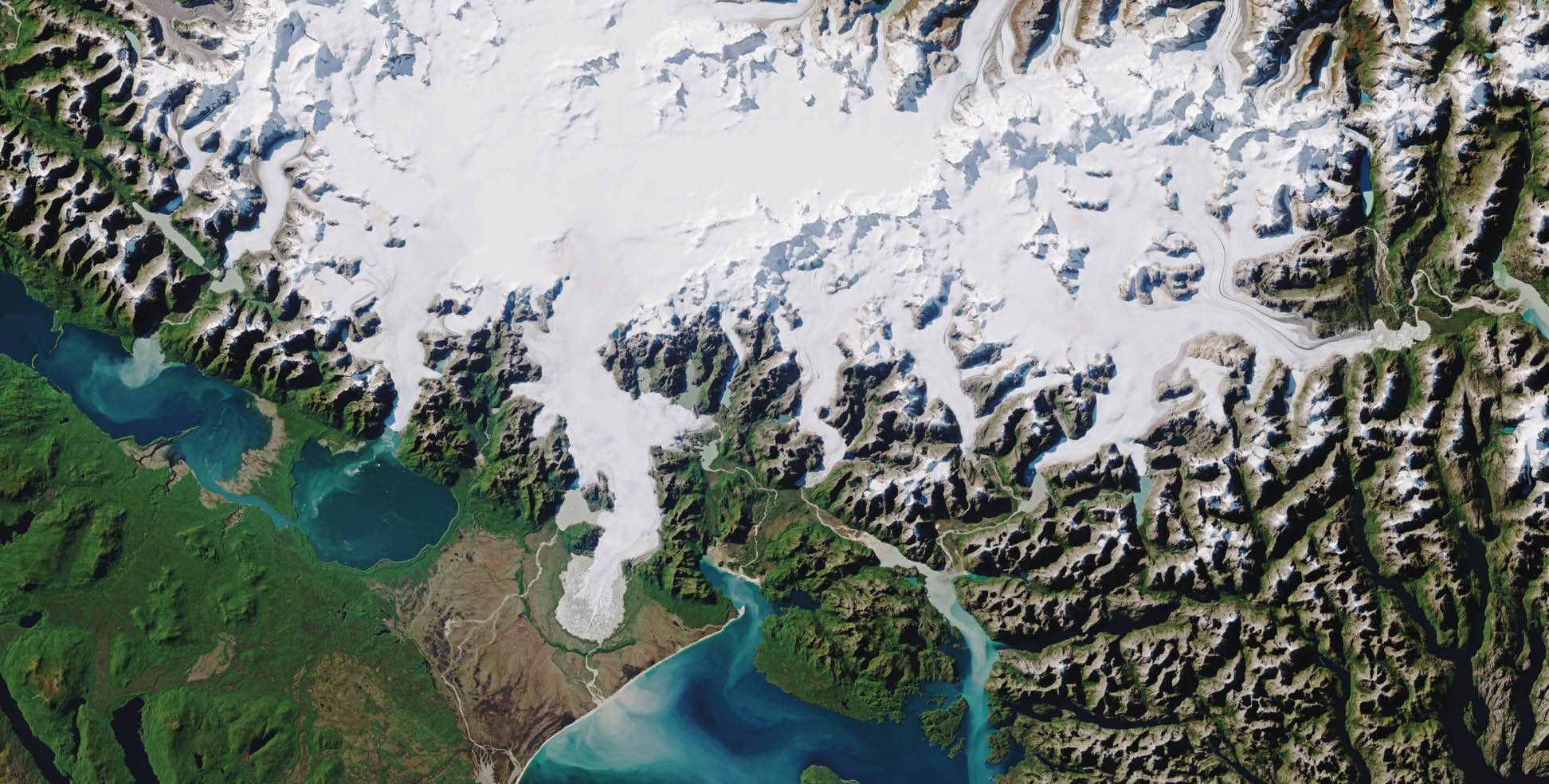  In April 2017, Landsat 8 captured this rare cloud-free view of a portion of the North Patagonian icefield.  Ice creeps downslope through mountain valleys and exits through so-called “outlet glaciers.” Many come to an abrupt end on land, while others terminate in water. The San Rafael and San Quintín glaciers (shown at the right) are the icefield’s largest. Both have been receding rapidly in the past 30 years.