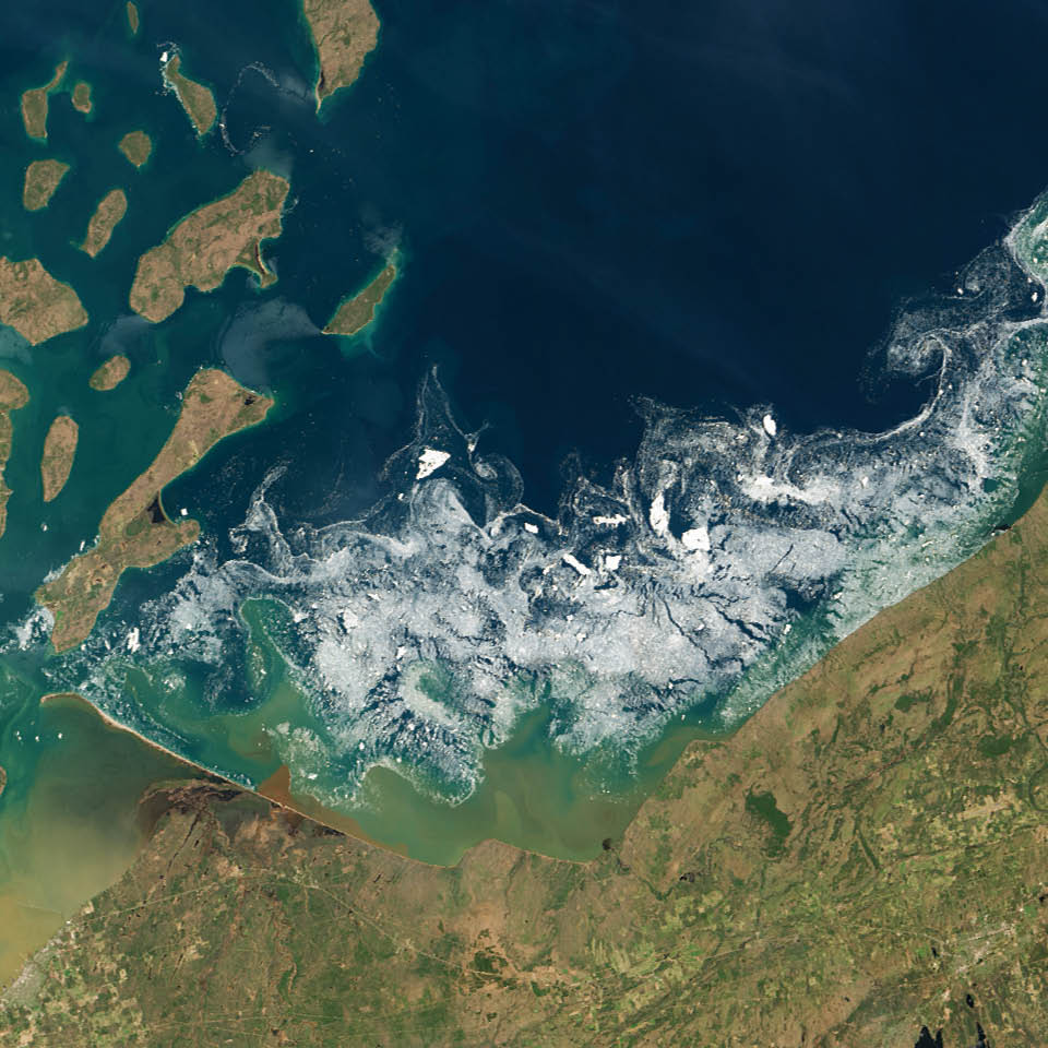 In 2014, the last ice of the Great Lakes melted in mid-June. On May 23, 2014—the start of Memorial Day weekend (and unofficial start of summer in the United States)—Landsat 8 captured this image of ice in Lake Superior near Chequamegon Bay, Wisconsin.