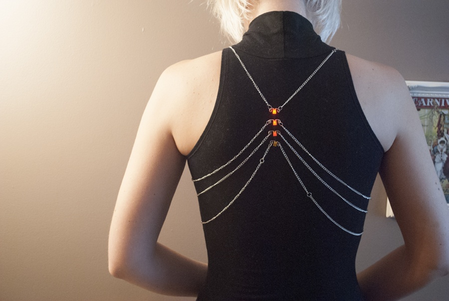 “Connection and Motion” by Izzie Colpitts-Campbell; this wearable circuit uses stainless-steel-coated brass chain to connect LEDs to a battery pack