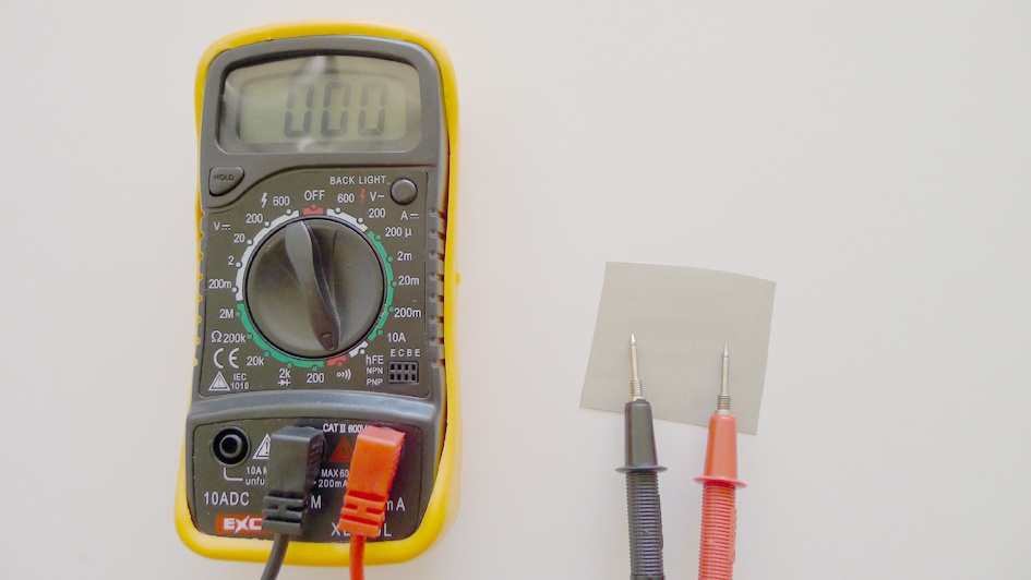 Using a multimeter to test the conductivity of conductive fabric