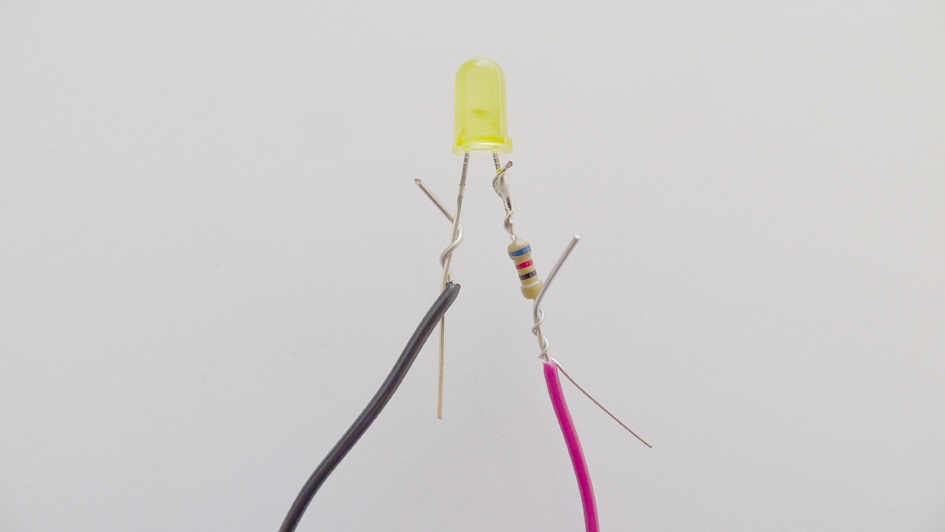 Wrapping black wire around negative LED leg and red wire around resistor leg