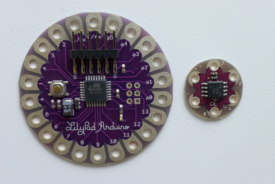 The LilyTwinkle (right) is much smaller than a LilyPad Arduino 328 (left)