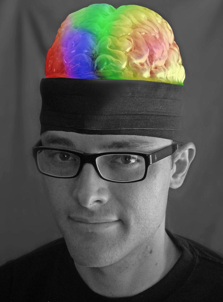 Sean Montgomery creates a variety of biometric-data-driven wearables; he is pictured here wearing his “Thinking Cap,” which responds to fluctuations in EEG signals