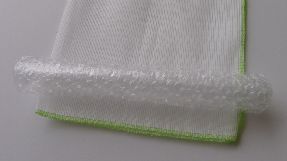 When storing the textile, you can use a bit of bubble wrap to support it in a roll