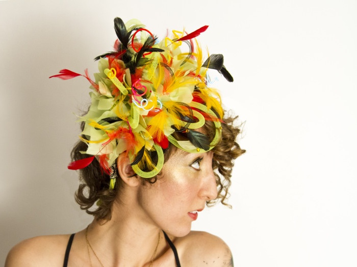 “Electric Parrot Fascinator” by gaïa orain (modeled by Carson Chodos) brings EL wire to life in a colorful headpiece