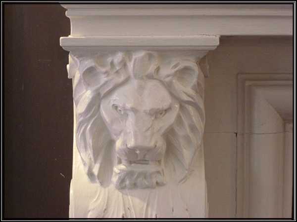 Picture of the lion head column left of the fireplace.