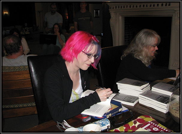 Picture of Nikki Boscia and Loren Rhoads autograph copies of The Haunted Mansion Project: Year One.