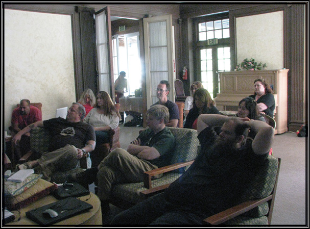 Picture of everyone listening to the GhostGirls’ presentation on the house.