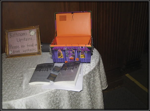 Picture of a treasure chest of goodies and The Haunted Mansion Project: Year One.