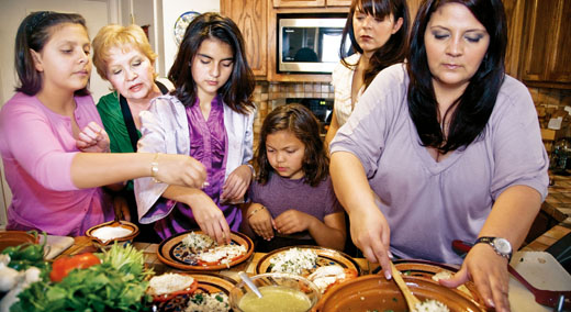 Three generations of the Enriquez family—esteemed for their cooking—prepare dinner at their home in El Paso, Texas.