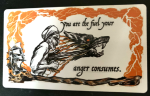 A card depicting a wolf's head bursting from a person's chest, in profile. It reads: You are the fuel your anger consumes. Orange thunderclouds and a sailboat on water border the image and words.