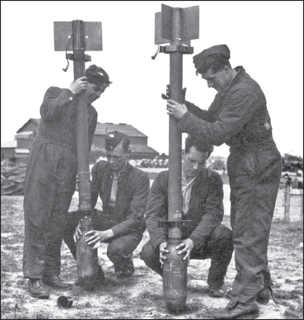 Airmen with a 60-pound rocket, the kind used ...