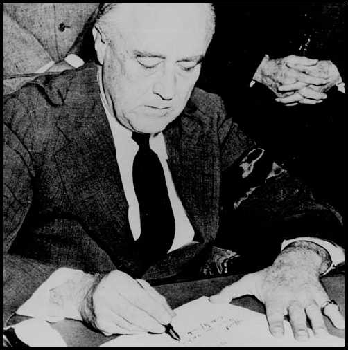 President Roosevelt signing the declaration of war against Japan, 1941.