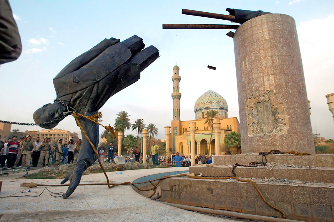  US troops topple a statue of Saddam Hussein in Baghdad, Ira q