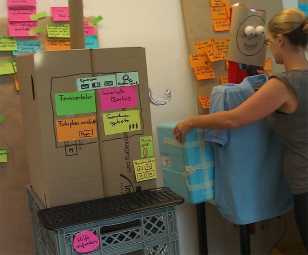 Experience prototyping with cardboard props standing in for appliances and people (image: D-LABS)