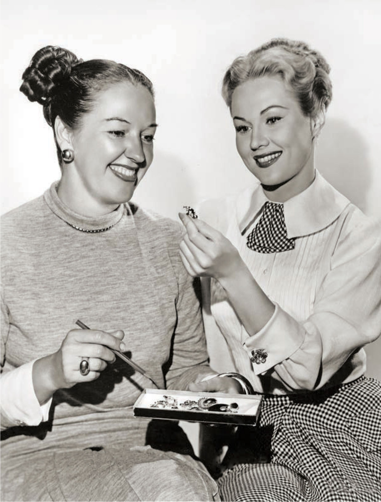 Designer Leah Rhodes (left) and actress Virginia Mayo.