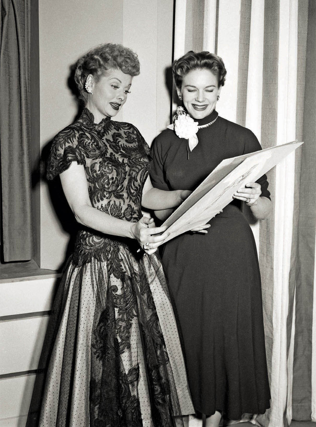 Lucille Ball (left) and Elois Jenssen look over sketches for I Love Lucy.