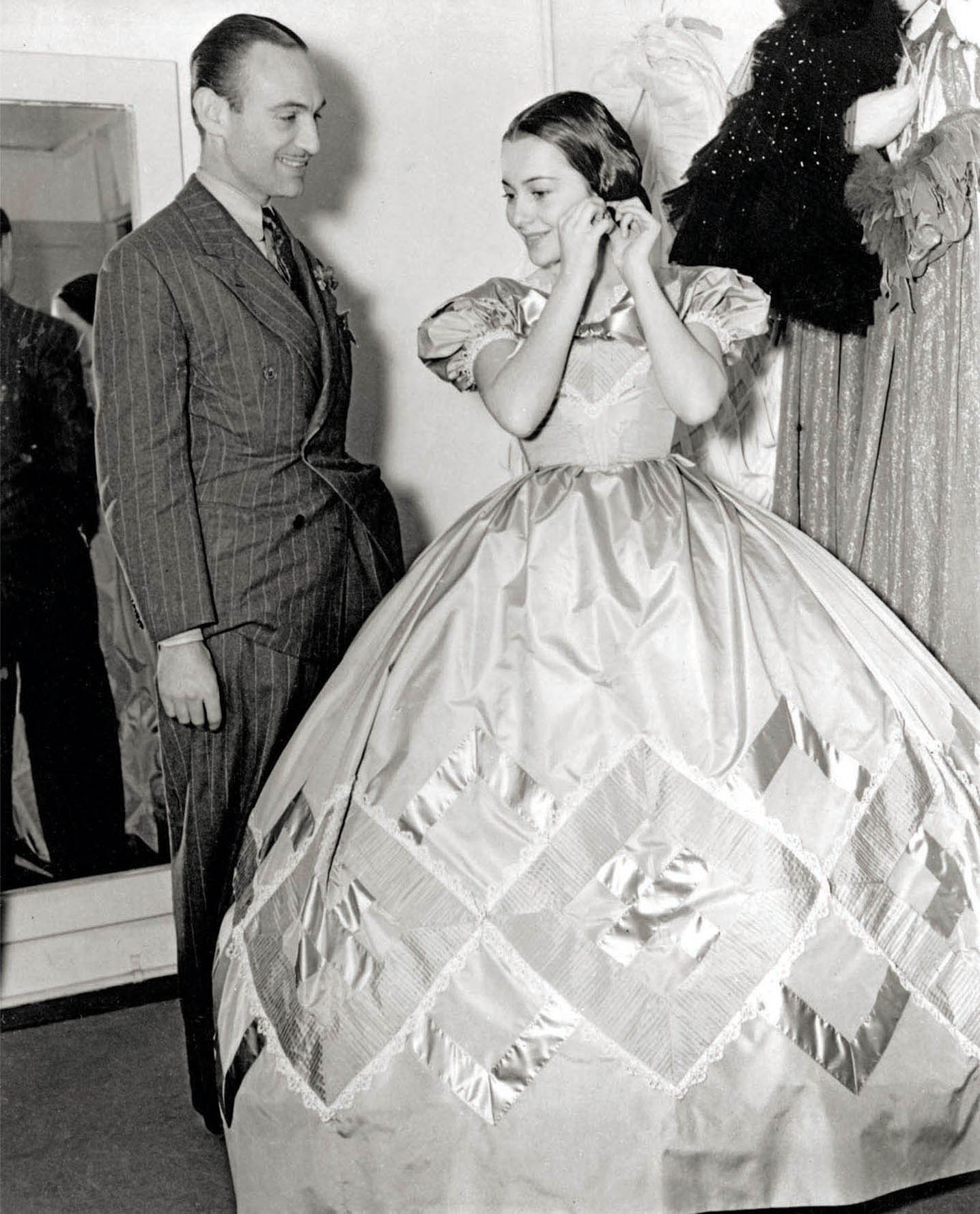 Walter Plunkett and Olivia de Havilland on the set of Gone with the Wind.