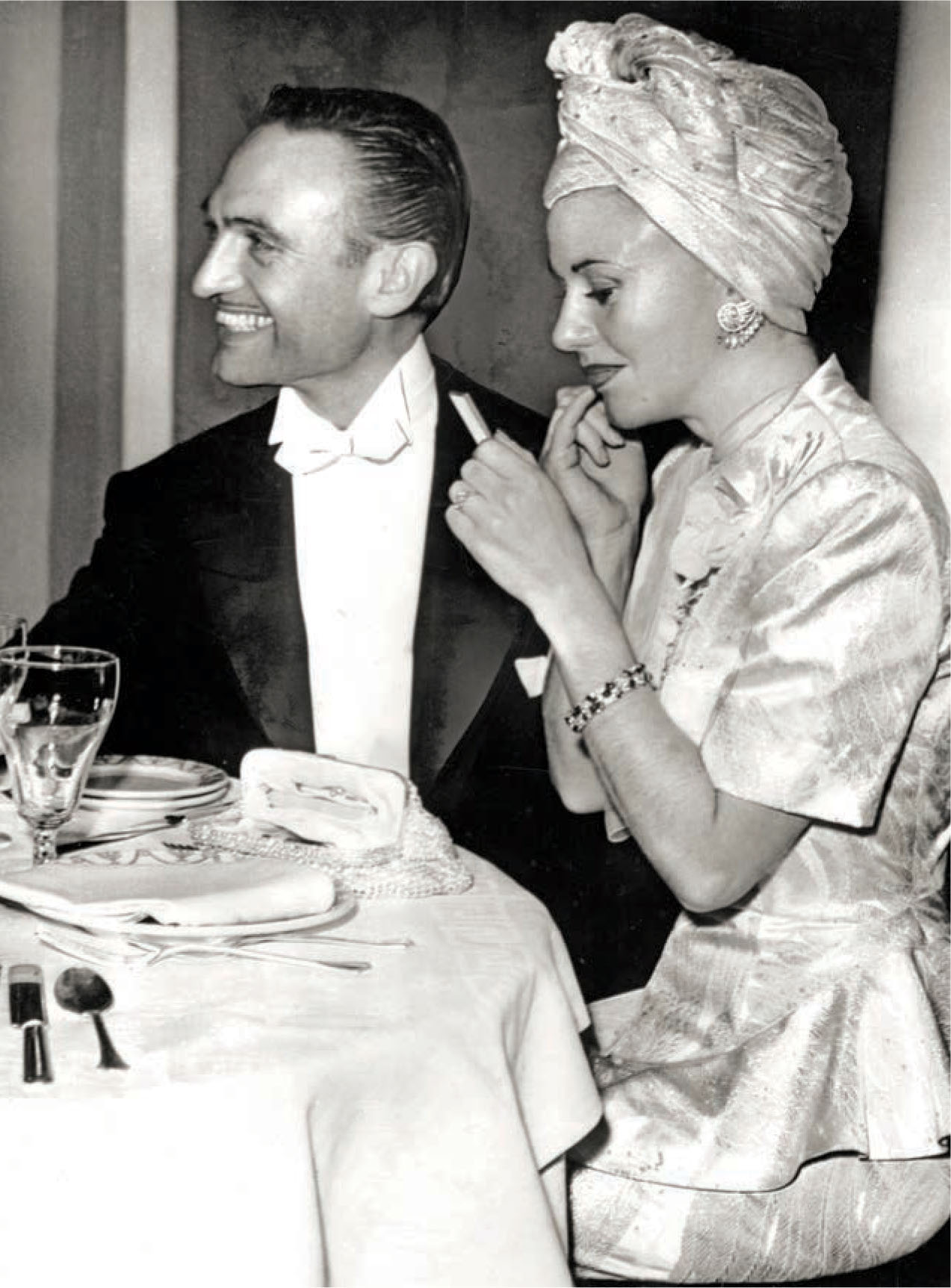 Walter Plunkett and Ginger Rogers attend the after-party for the premiere of Gone with the Wind.